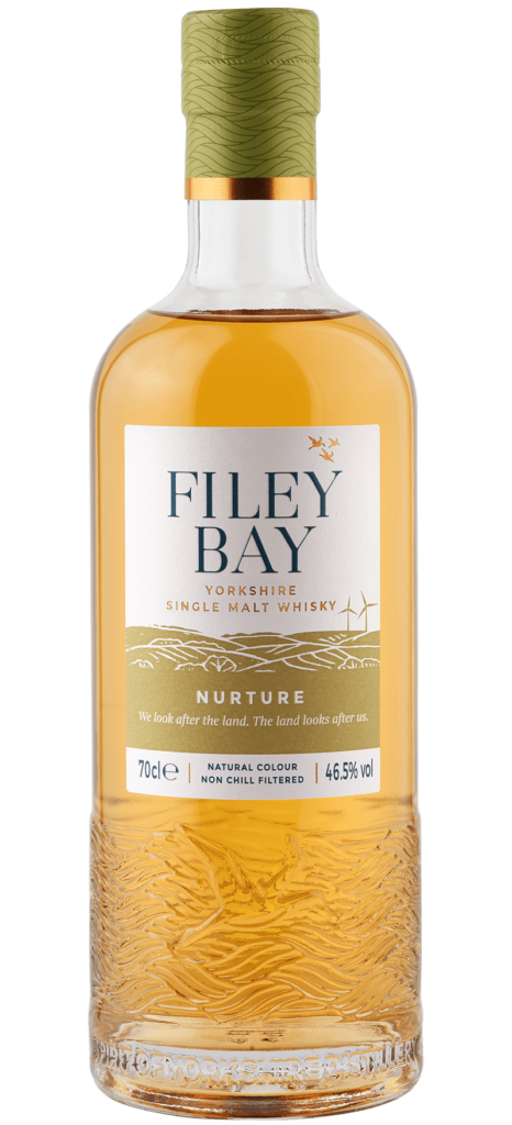 Filey Bay Nurture bottle of whisky in a barley field about to be combined on our family farm.
